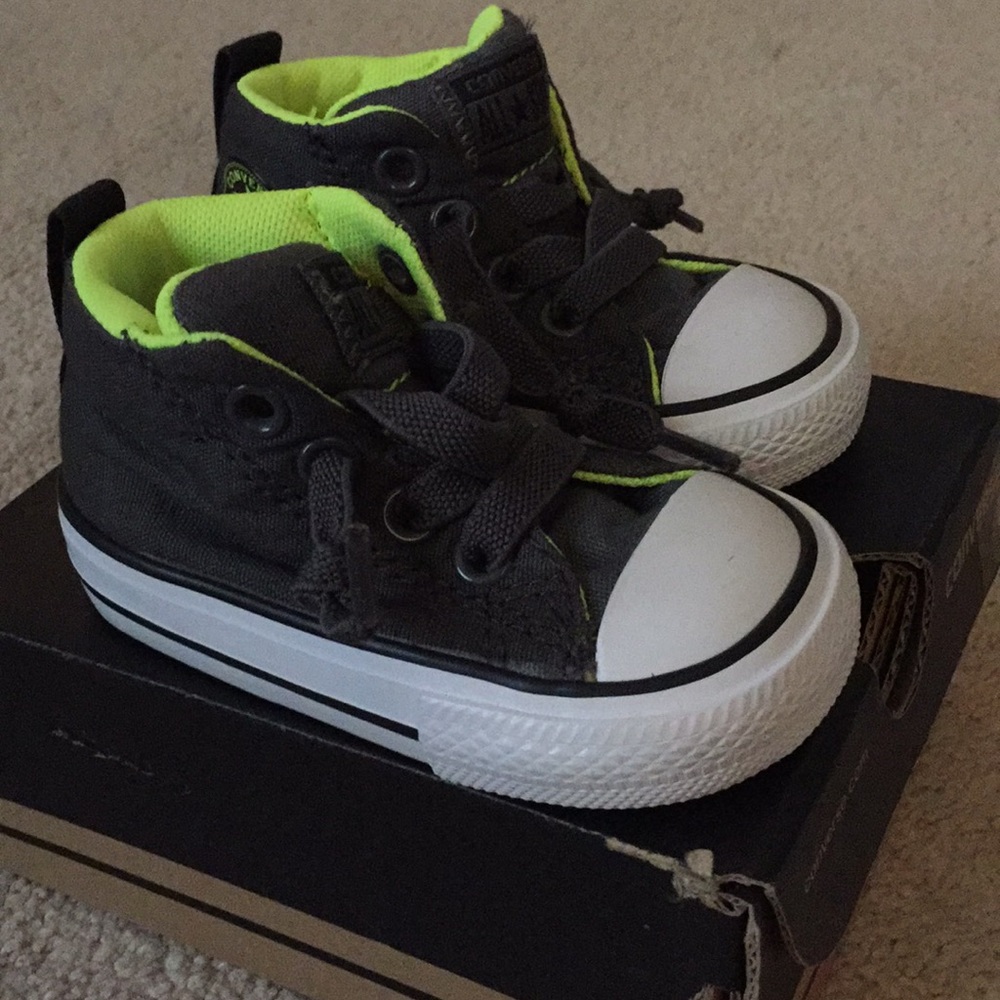 Dark gray lime green hightop converse
